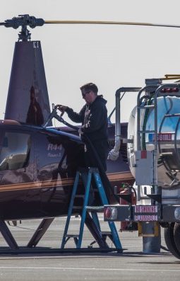 jetCenter staff refueling a helicopter on the ramp