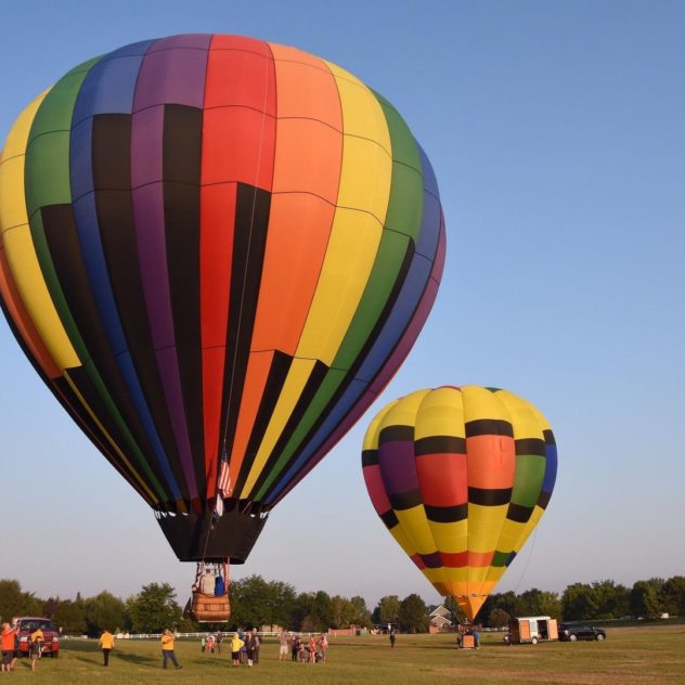 Hot air balloons taking off at dawn for the Winder Harvest Fest