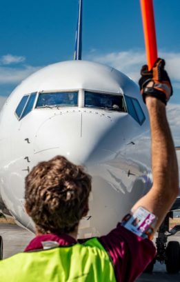 image of jetCenter employee marshalling in aircraft on the ramp