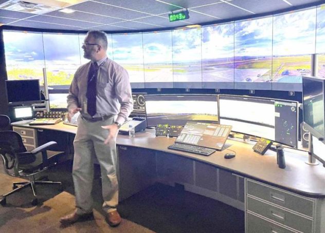 image of Airport Director, Jason Licon, before the Colorado Remote Tower video wall