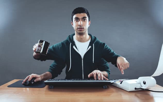 man with 4 arms multitasking at office work