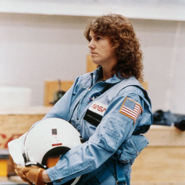 Image of Sharon Christa McAuliffe, first teacher selected for NASA's Teacher-in-Space project, holding a helmet. 